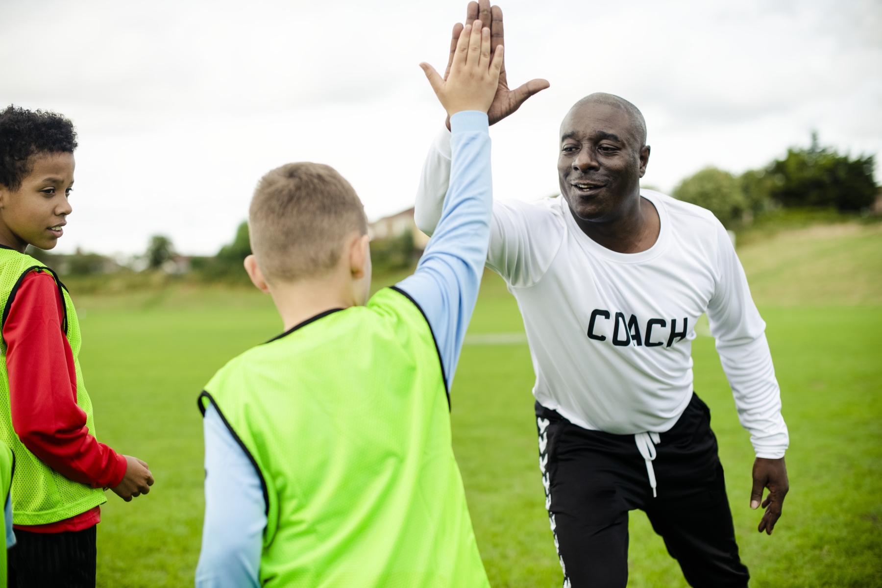 Man High Fiving Athlete