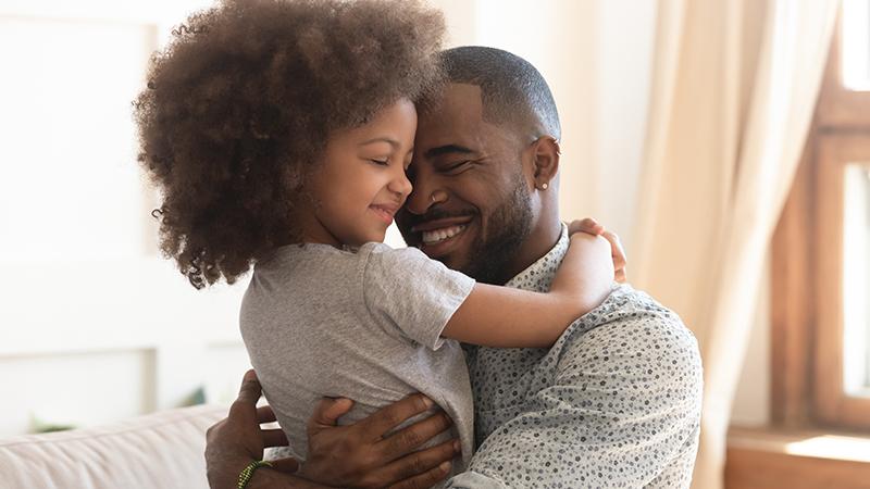 Father hugging child