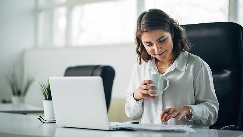 Woman in a conference room with a laptop